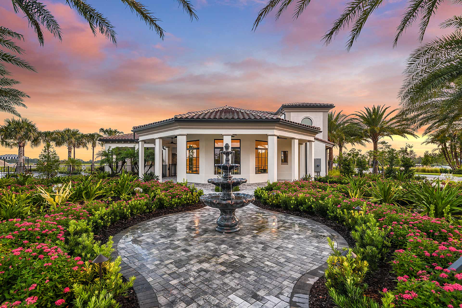 Pavilion at dusk with fountain and pink pentas — Club Aria, Florida